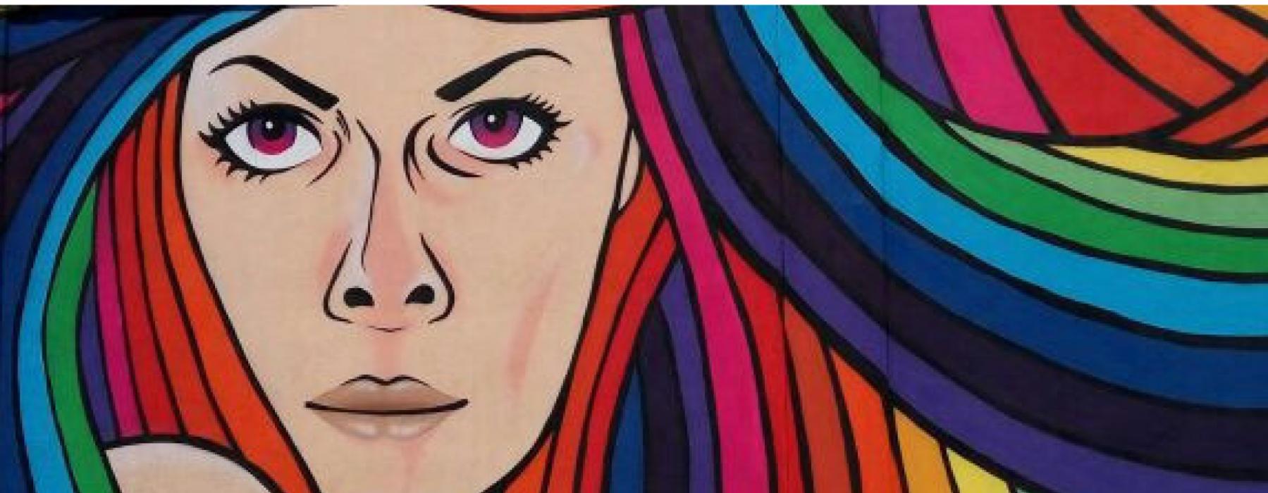 Murales con volto di donna con capelli dei colori dell'arcobaleno